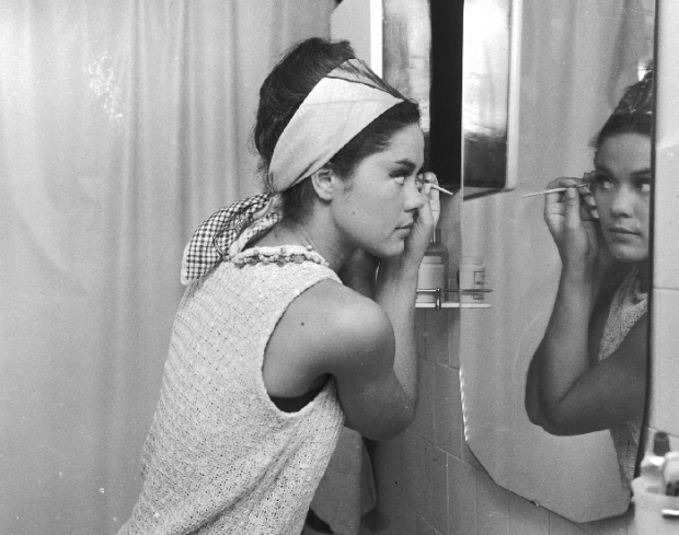 Girl applying makeup